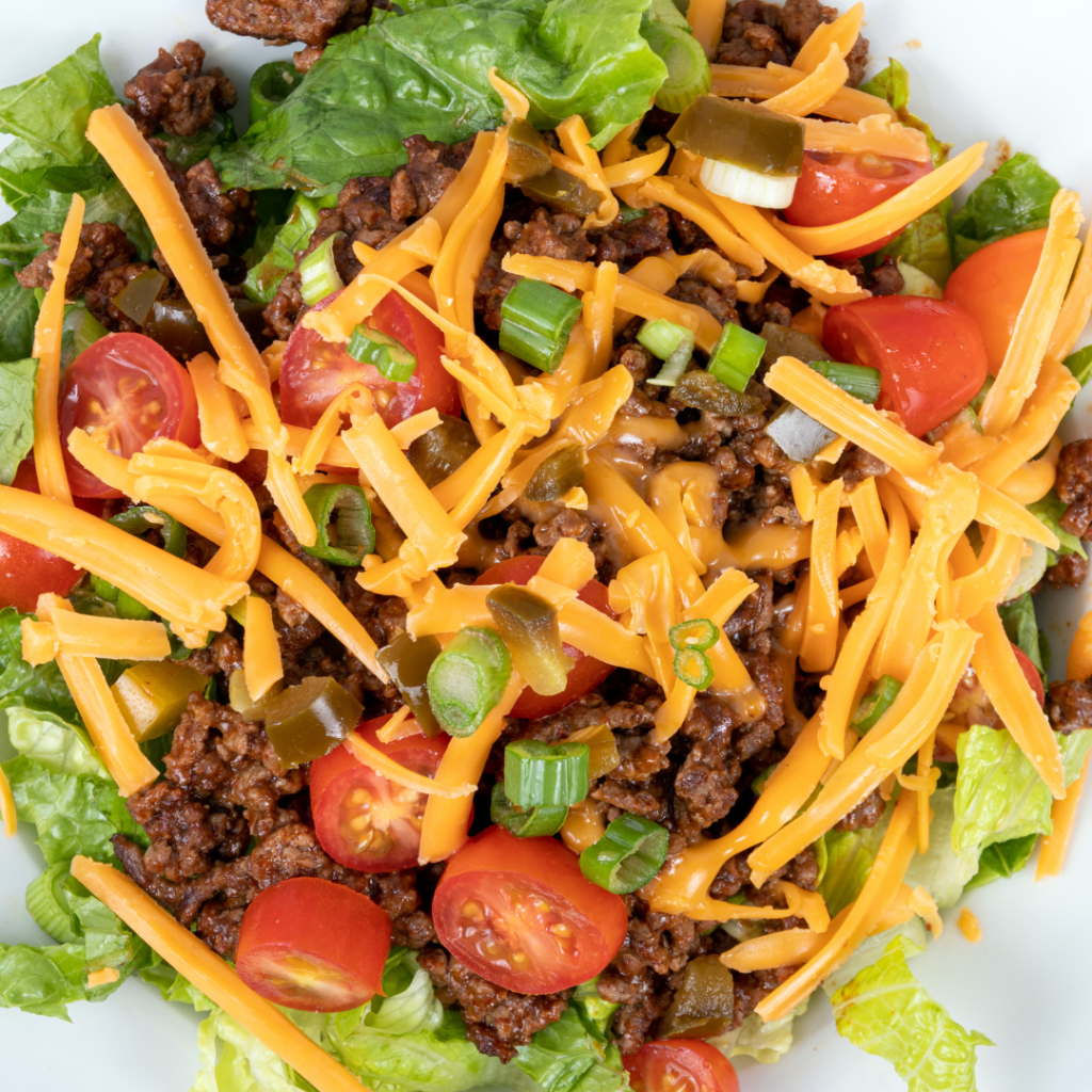 Colorful and balanced taco bowl filled with seasoned protein, fresh veggies, grains, and a drizzle of sauce — a nutritious and fun twist on a classic favorite.