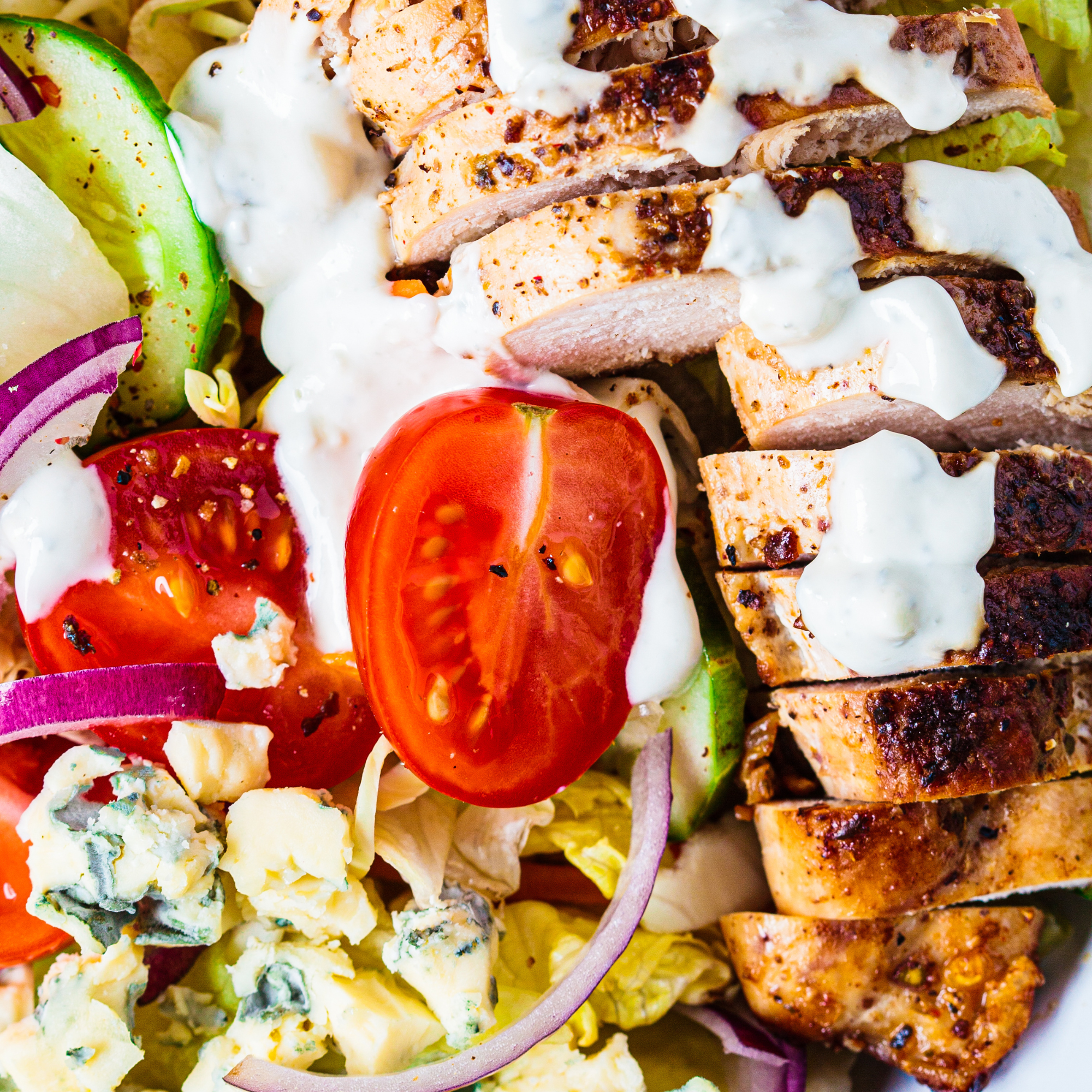 A bold and balanced Buffalo Chicken Bowl with spicy chicken, fresh veggies, grains, and creamy toppings — a flavorful and nourishing choice that satisfies cravings.